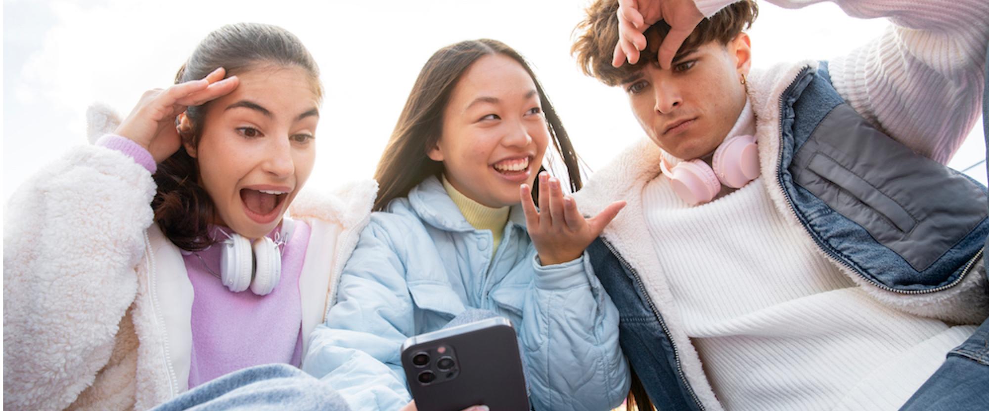 Teenagers having fun trying music-sharing apps